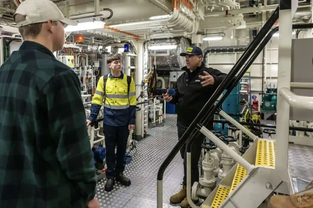 Crew member operating deck equipment