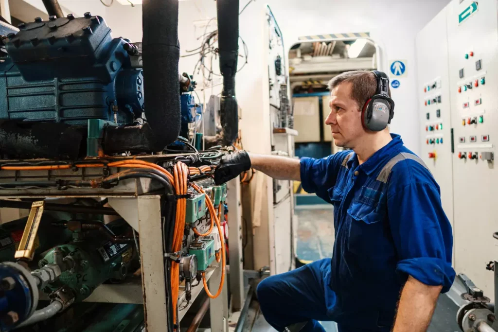 Working in the engine room of a commercial vessel